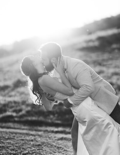 Bride and groom laughing together during golden hour wedding portraits at Obi Obi Hall in the Sunshine Coast Hinterland.