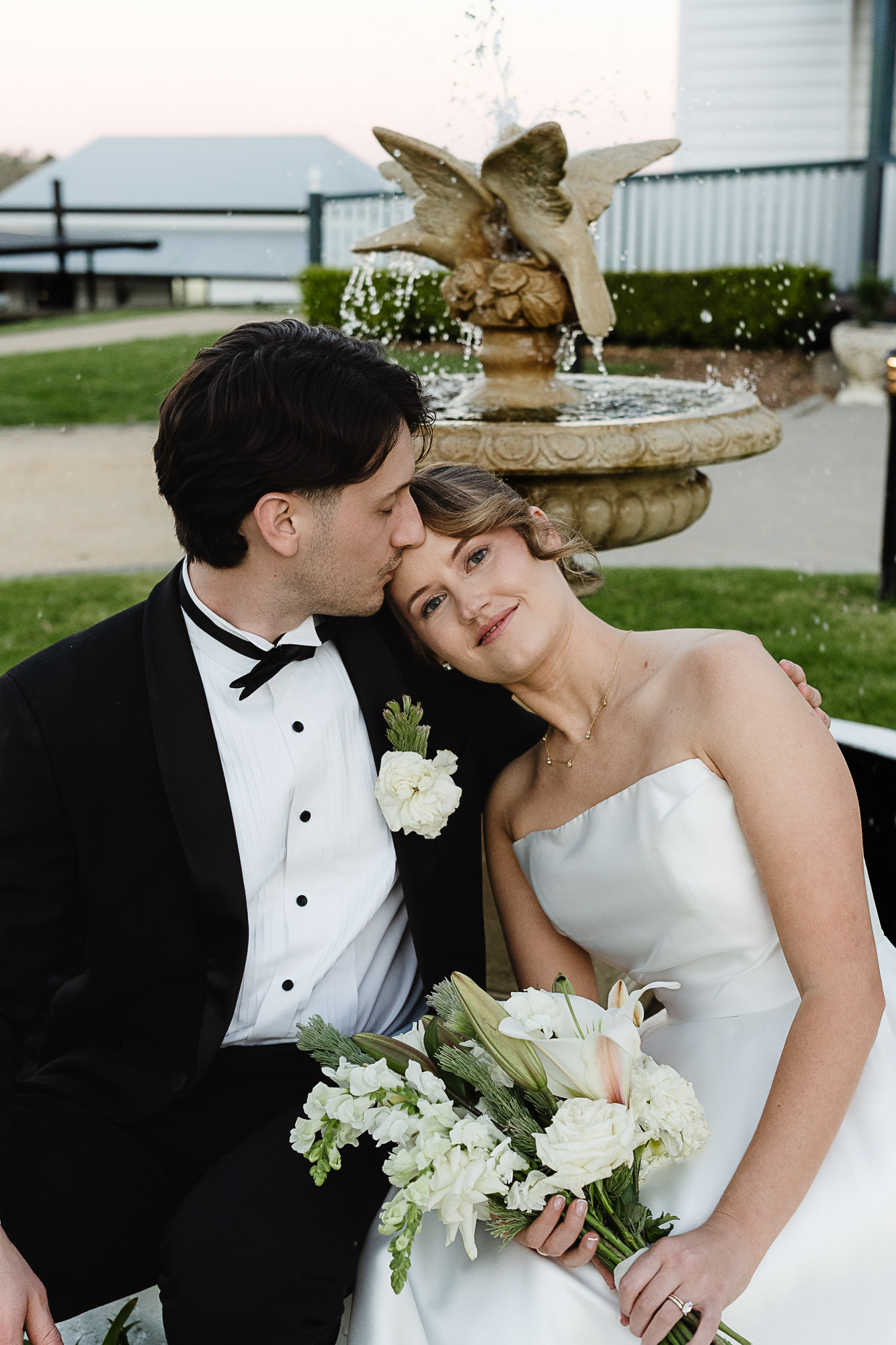 Toowoomba Wedding Photographer | Romantic Blue Hour Wedding Photography at Preston Manor Romantic blue hour wedding photography by a Toowoomba wedding photographer, capturing a bride and groom embracing at Preston Manor Village & Chapel.